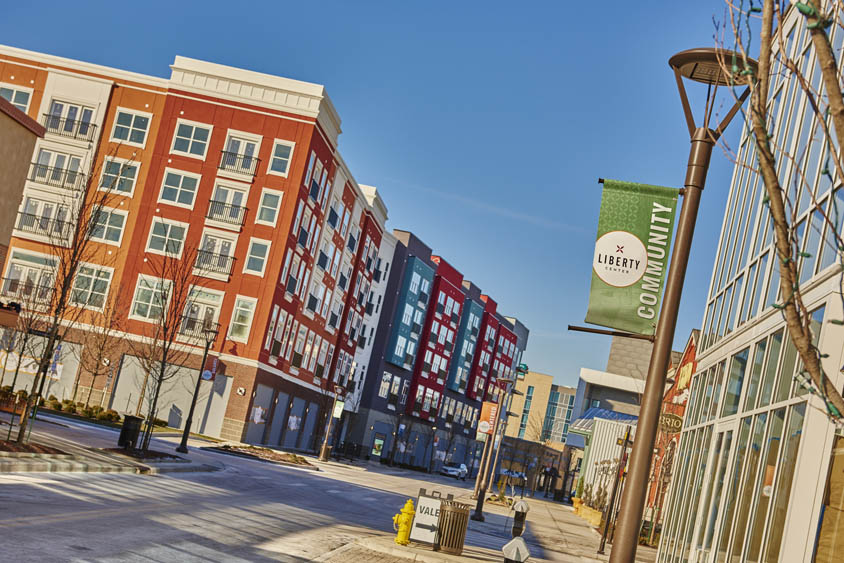 Street view of a colorful apartment building in Liberty Center